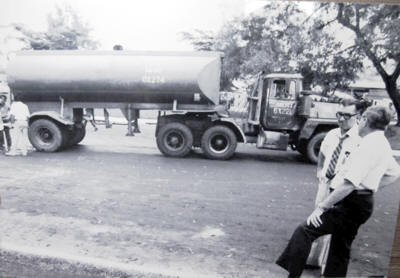 Frank Robin and James Gunther near a  tanker