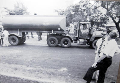Frank Robin and James Gunther near a  tanker